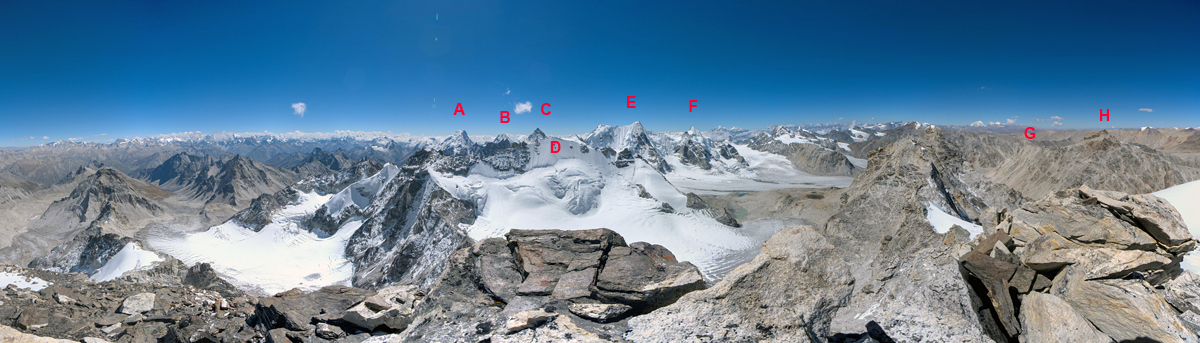 A south-northwest panorama from the top of Sumna Himal in the Changla Himal. The majority of peaks seen here remained unclimbed. (A) Peak 6,246m. (B) Peak 6,028m. (C) Peak ca 6,000m. (D) Lore Peak (6,080m). (E) Nyalu Lek (6,265m). (F) Nying Himal (6,140m). (G) Steph Himal (5,878m). (H) Phasang (6,065m). In the distance are big peaks such as Saipal, Api, Gurla Mandata, and Kailash. 