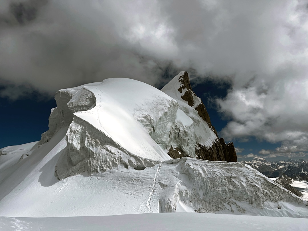 Along the west ridge during the descent from the summit of Chumik Kangri (6,754m), visible in back.