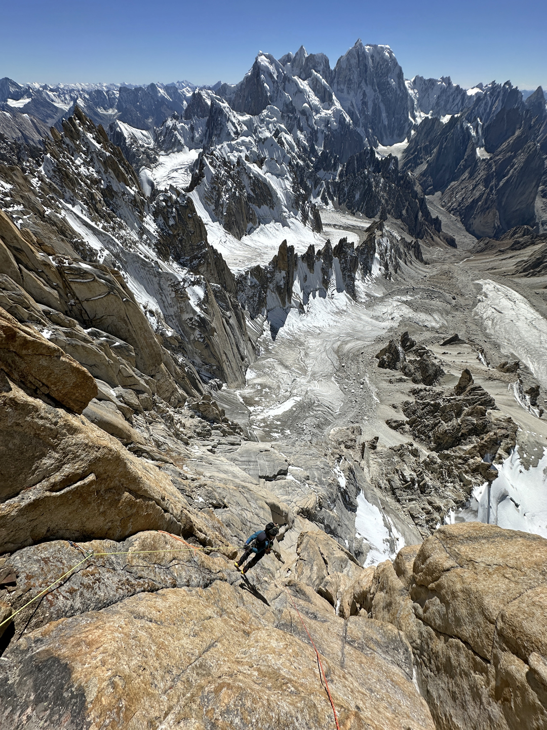 High on Sangar Tower on the final day of the ascent of the west face. The formidable north face of Dansam is visible in the distance. 