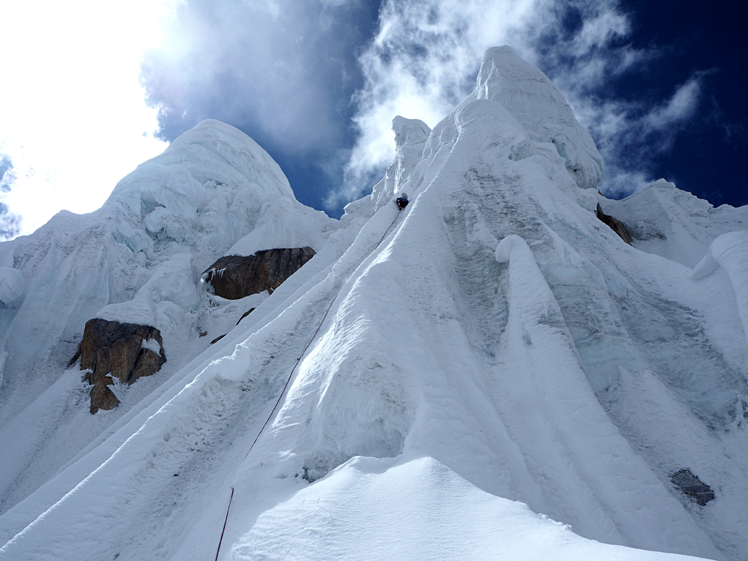Around 100 meters directly below the top of the snow and ice tower on the summit ridge of Hunza Peak.