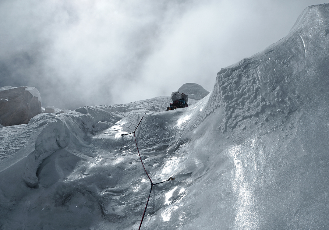 Climbing hard, textured ice on the final day to reach the top of the southeast face of Hunza Peak. 