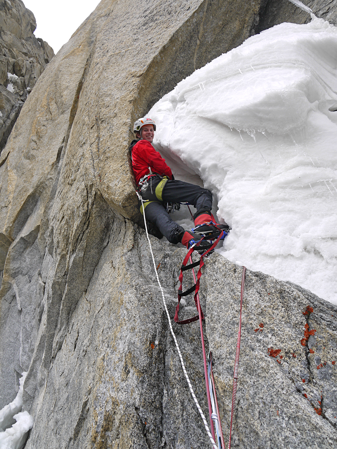 Florian Jehle about to start excavating a tunnel behind a large snow formation low on the southeast face of Hunza Peak. He would emerge through the gap at the top of the picture.  