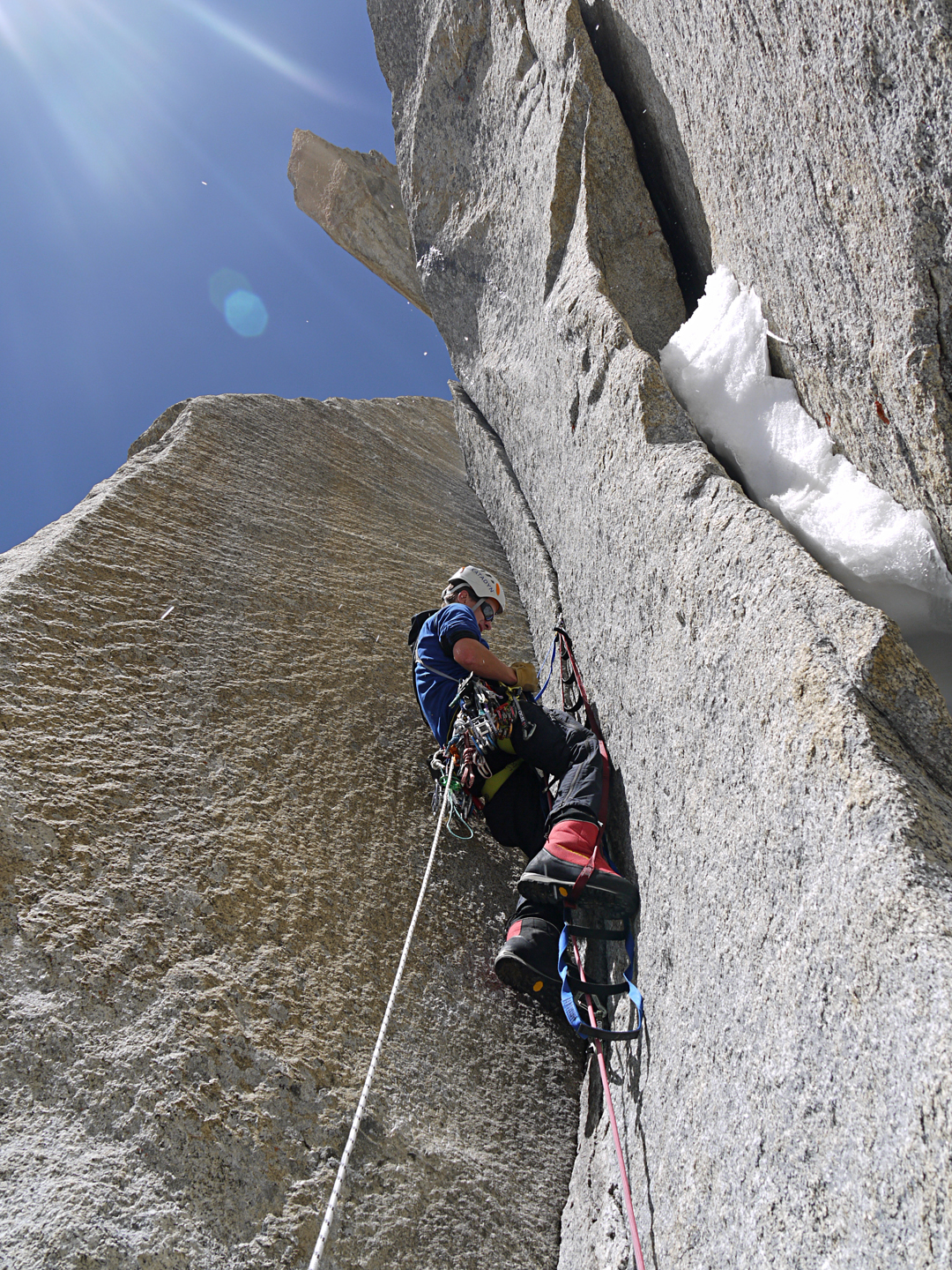 Julian Beermann aiding on the lower rock section (pitch three or four) of Sujo, southeast face of Hunza Peak.  