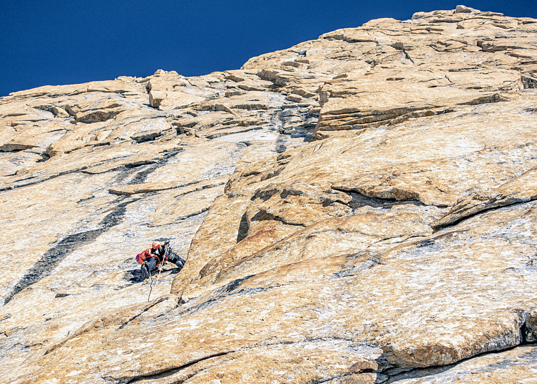 High on Latok III southeast pillar, Thomas Huber explores the excellent golden granite. 