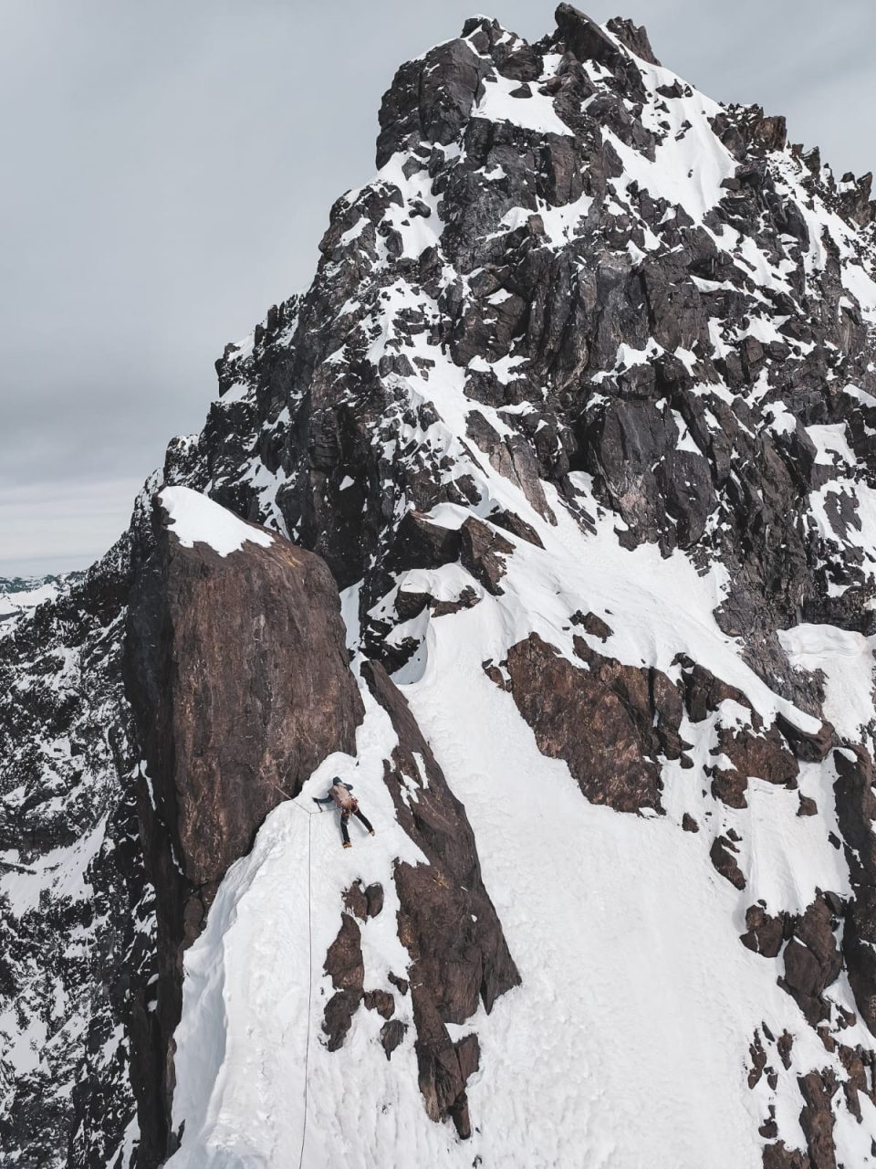 Raimundo De Andraca traversing tricky terrain high on the south ridge of Cerro El Brujo Sur. 