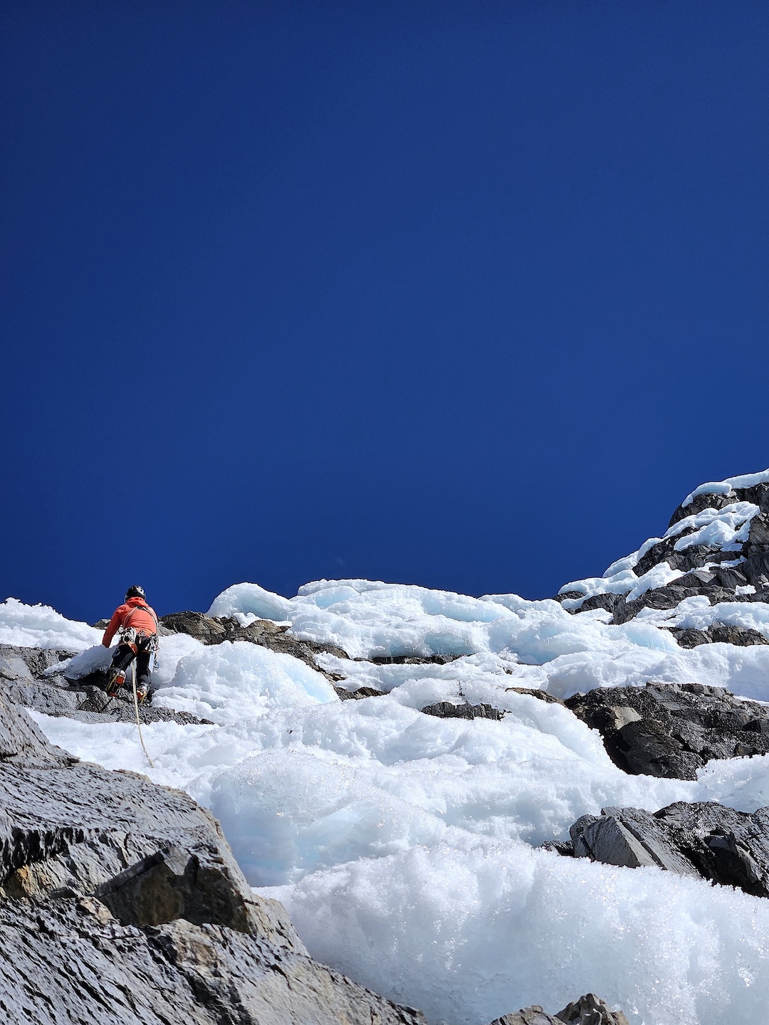 Eneko Pou on the upper section of ice and rock on the second day of the new route on the northeast face of Jurau A. 