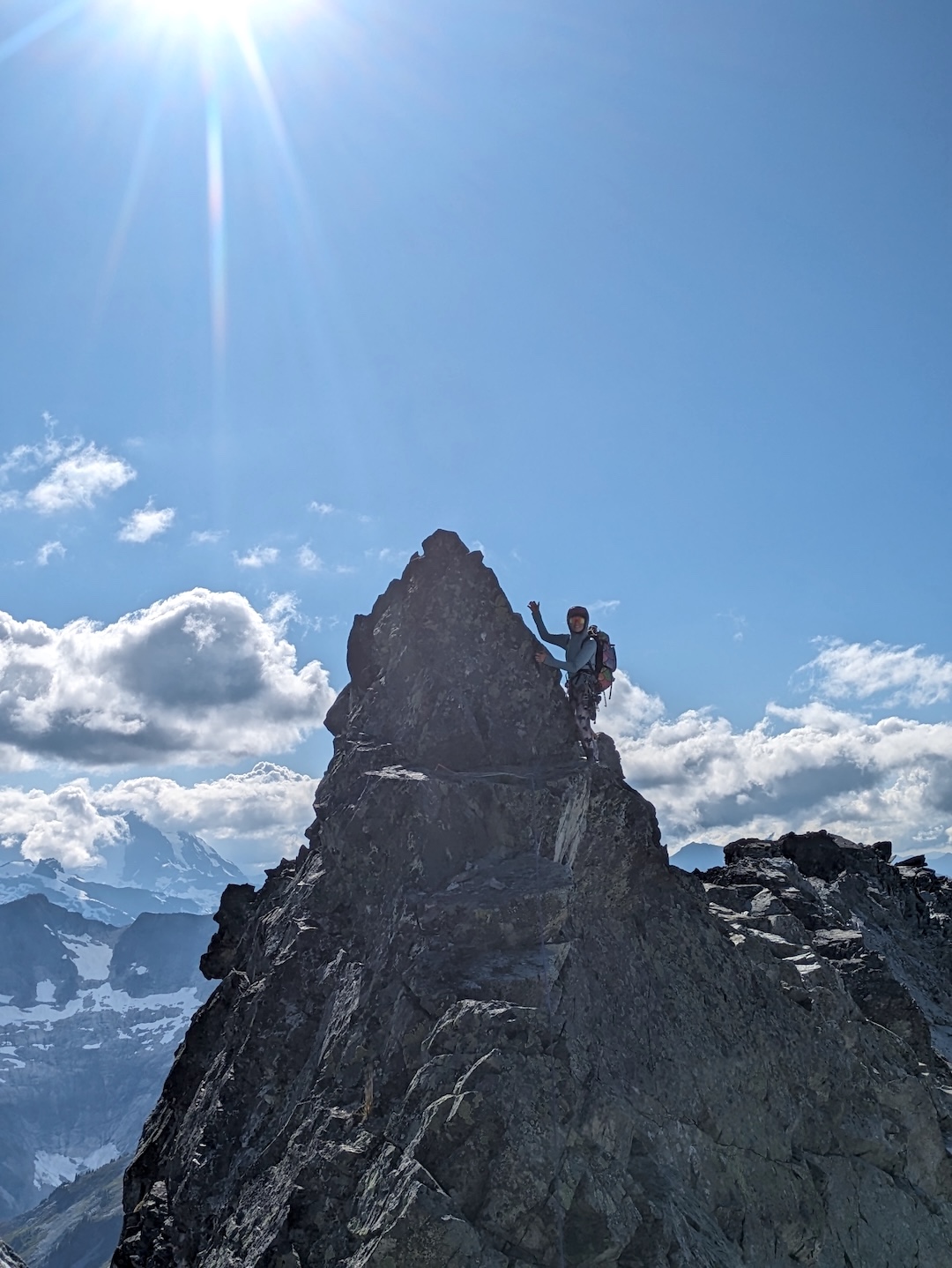 Lani Chapko on top of a gendarme near the summit of Whatcom Peak, while climbing The Imperfect Bypass. 
