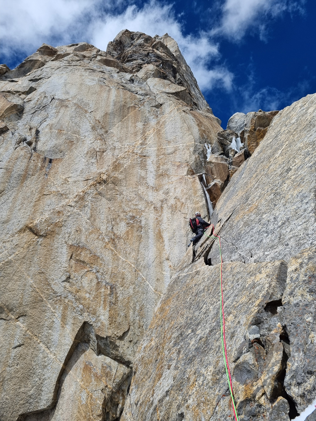 Jacek Czech on the southeast face of Laila Peak, climbing up to the small saddle behind the “pulpit,” where the team left some gear. This is pitch five (IV+) on the topo. 