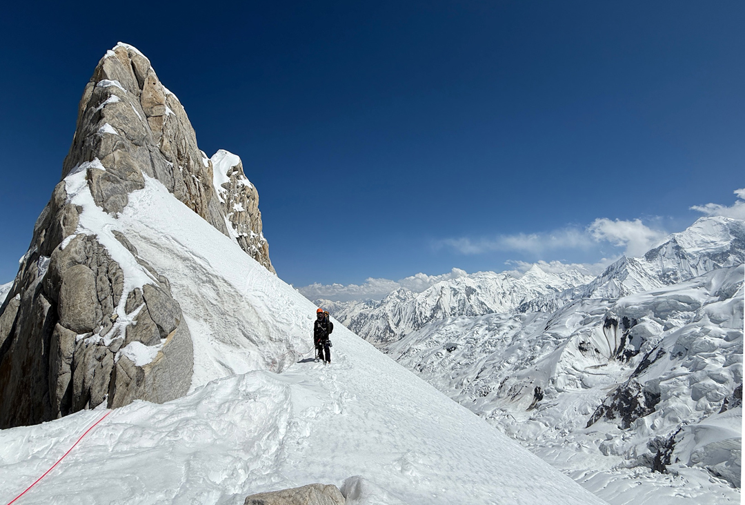 Mueez Ud Din approaching the bivouac site on day one of the ascent of the east ridge of Spantik. Peaks of the Haramosh Group are to the right. 