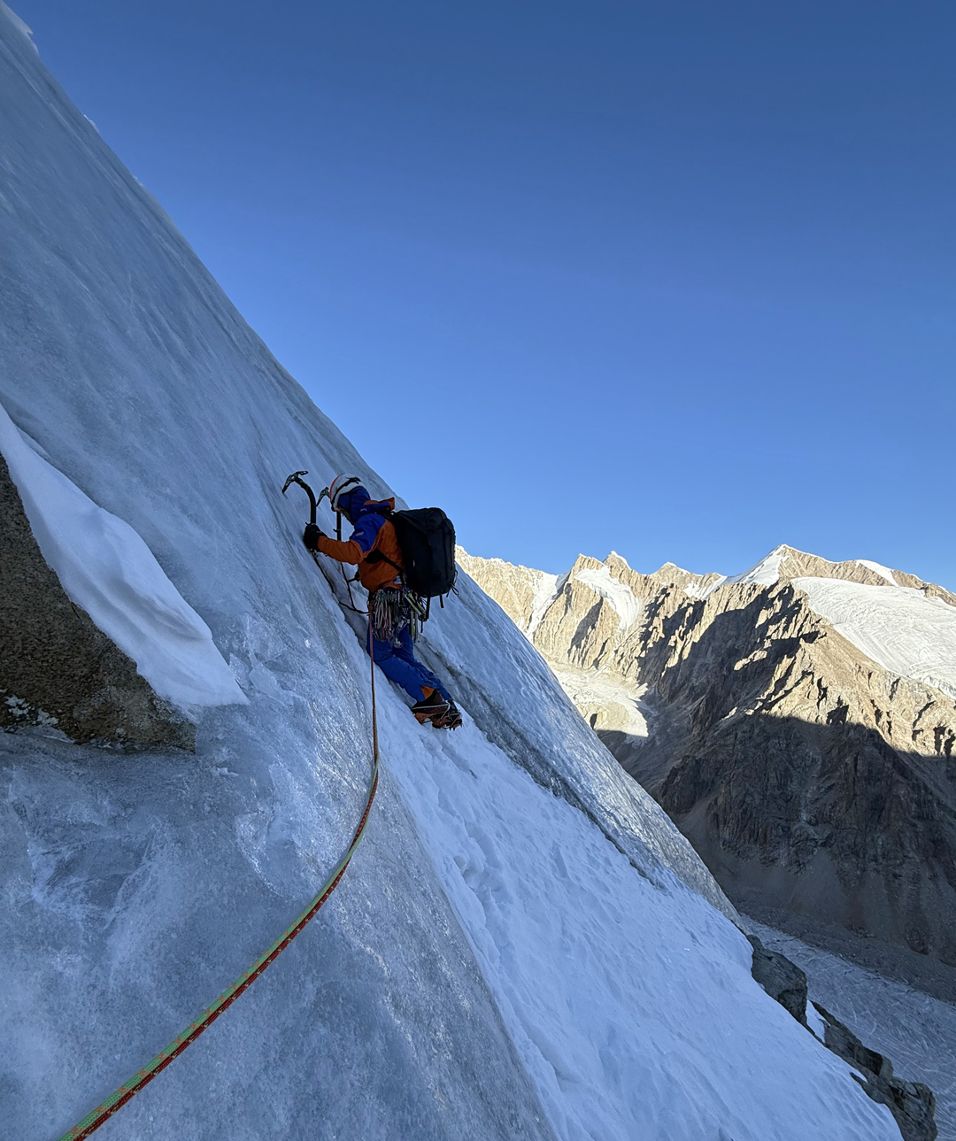 Matej Prcin climbing early in the morning of the second day on the northwest face of Tumladen Sar. 