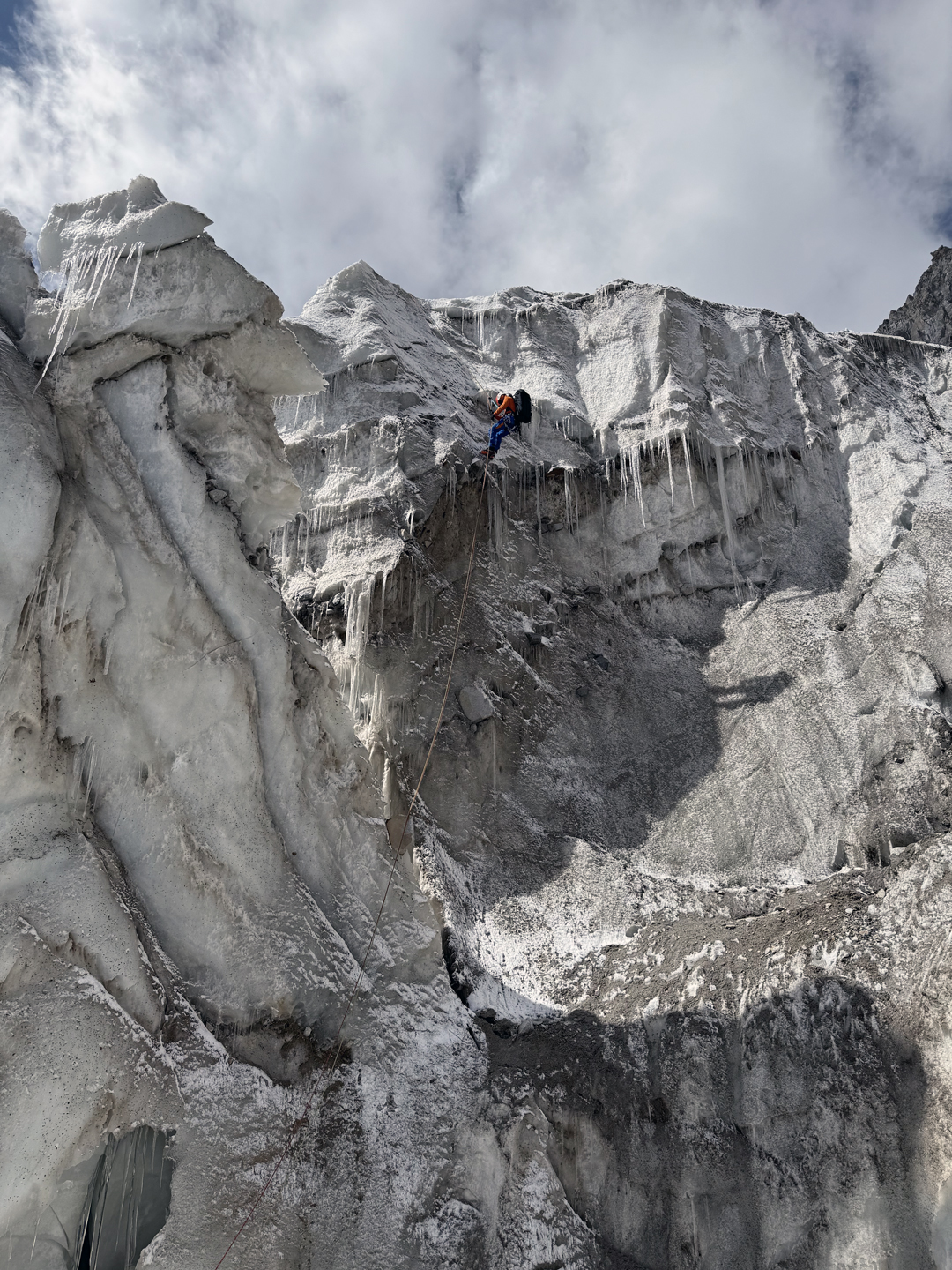 Rappeling an overhanging serac during the descent from Tumladen Sar.