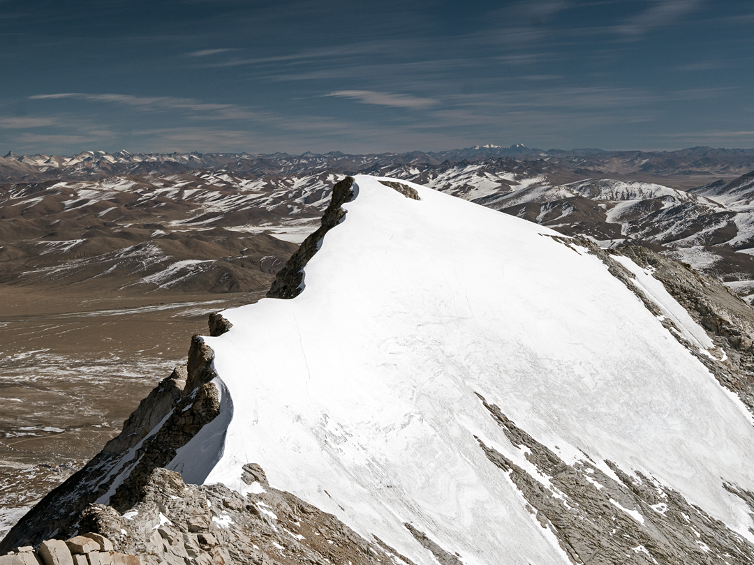 View of the summit of Chhuama II and across the Tibetan Plateau from the east-northeast ridge of Chhuama I. 