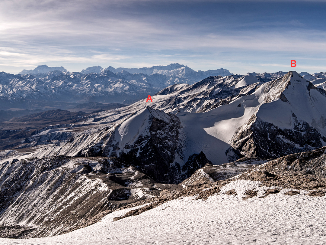 Looking south from the slopes of Chhuama II. (A) Peak 6,007m. (B) Dong Mar (6,337m), first climbed by the Austrian Herbert Tichy in 1953. In the far distance, across the Kali Gandaki Valley, is the Annapurna Range. 