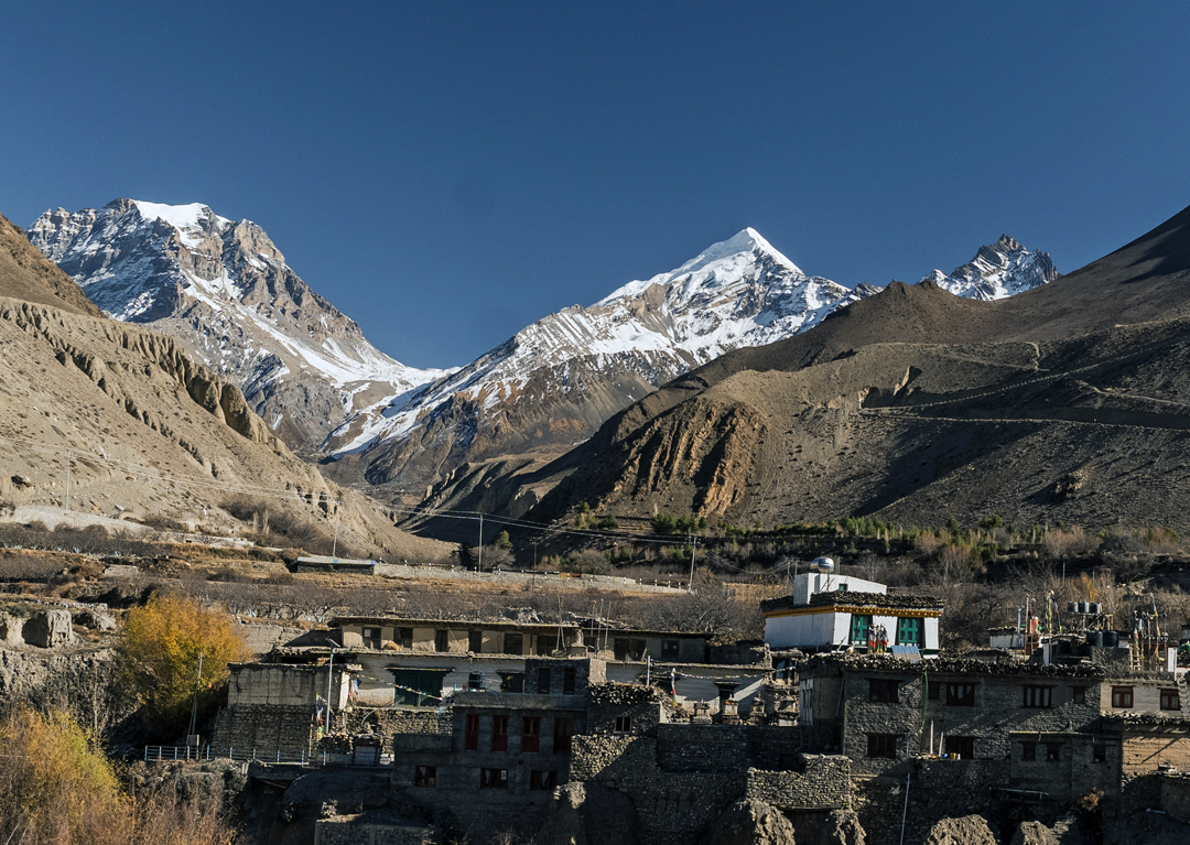 The view east from Muktinath, en route to northern Mustang. Yakawa Kang (6,482m, climbed in 2010 from the south by a Japanese team) is on the left, and Khatung Kang (6,484m, climbed in 1956 from the north by a Swiss team) is on the right, separated by the Thorong La. 