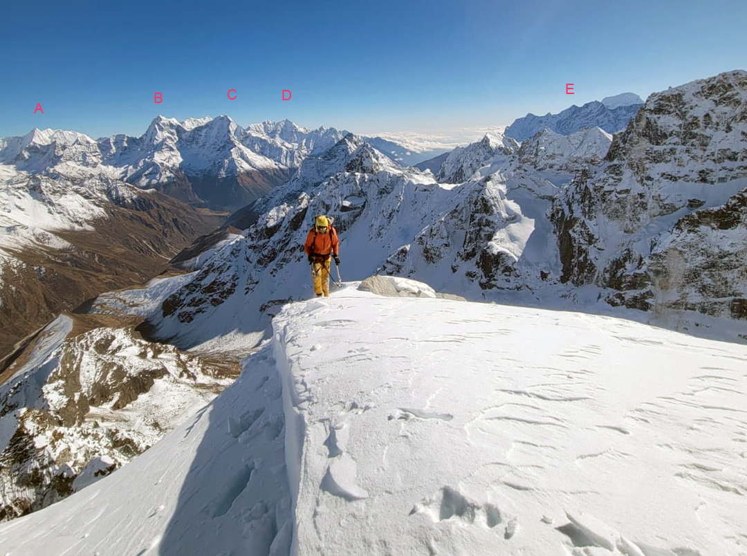 On the summit ridge of Pharilapcha, looking down the Gokyo Valley toward (A) Malanphulan (6,573m), (B) Kangtega (6,783m), (C) Thamserku (6,618m), (D) Kusum Kanguru (6,370m), and (E) the Kwangde group (6,186m). 