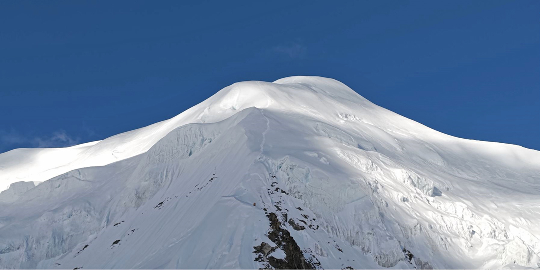 Descending the upper southwest ridge of Pathibhara Southeast (6,868m) after the first ascent of the mountain. 