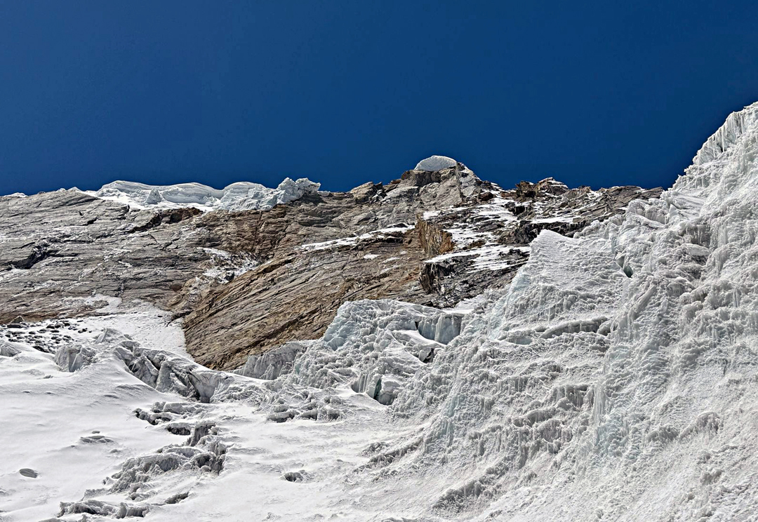 View of the summit area of Sharphu VI while ascending the complex glacier on the east flank.