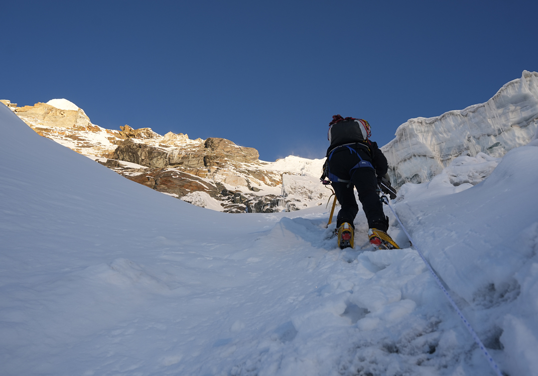 On the east face glacier of Sharphu VI. The summit is the ice-capped rock up to the left.