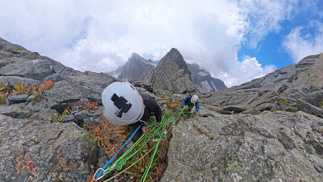 At the top of the second pitch above the col on the southeast ridge of Cathedral Dome. 