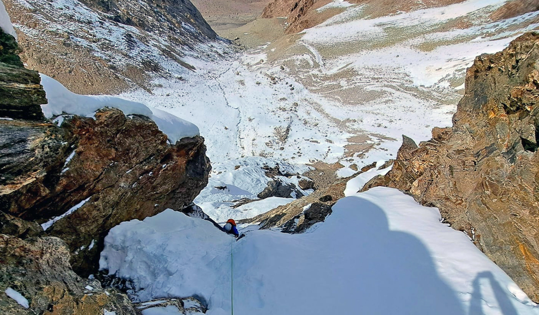 Hector Sanmiguel climbing through the rock barrier on Lymca Dahl, the 2025 Spanish route up the north face of Nochung Ri. 