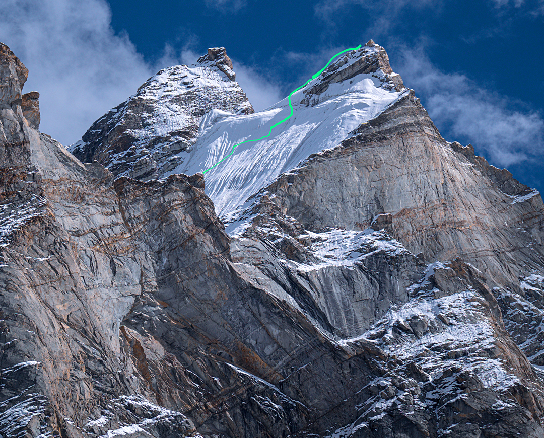 The Chorten Rigib summits seen from base camp in the Denyai Tokpo. On the left is Chorten Rigib East (ca 5,800m), climbed to around 20 meters below the summit by a route behind the left skyline. The lower Chorten Rigib West (5,752m) is on the right, with the route Julley Broer marked. 