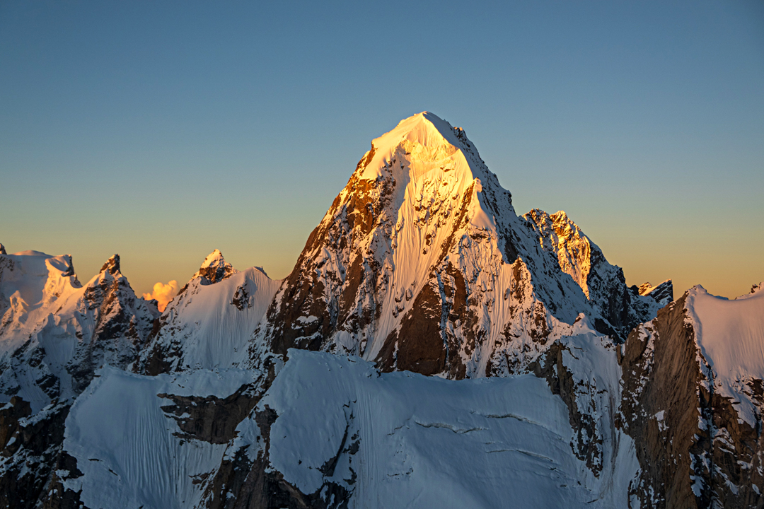 The unclimbed north face of Khang Chan Chemno (6,135m). The route of the first ascent climbed the northeast face (the face in profile on the left), finishing on a southeast-facing headwall. 