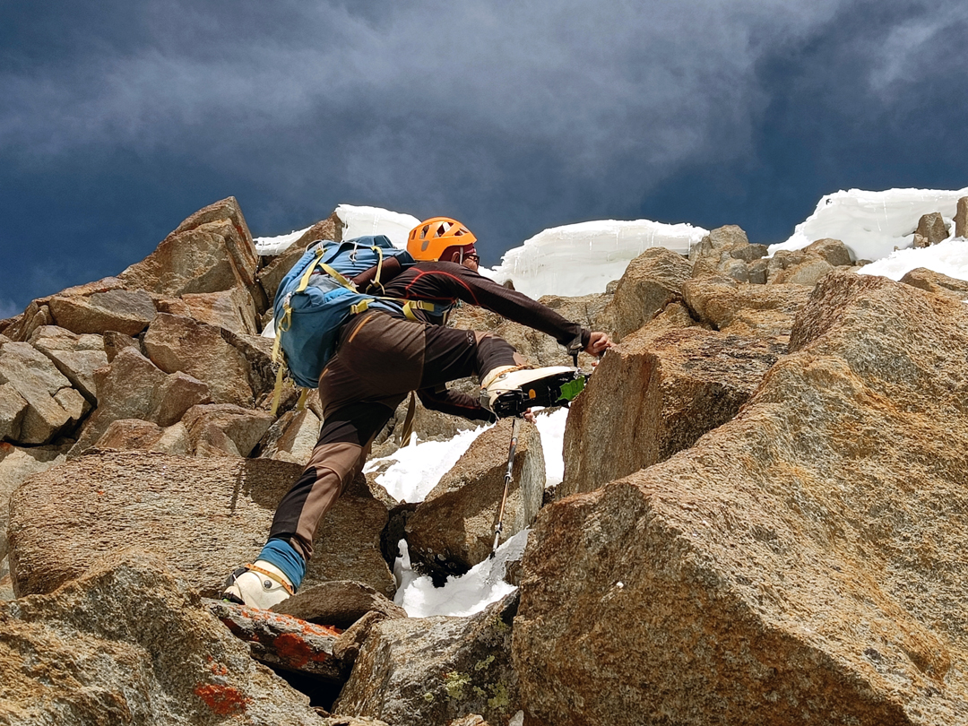 Lakpa Sherpa climbing to the cornices of the summit ridge of Peak 6,045m during the first ascent. 