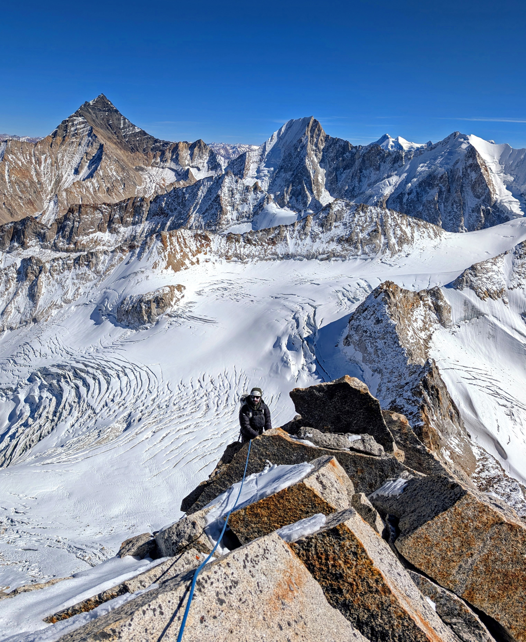 Ryan Griffiths high on the east ridge of Daboling. The rocky pyramid on the left is Phawararang (6,349m), climbed several times via the south ridge.