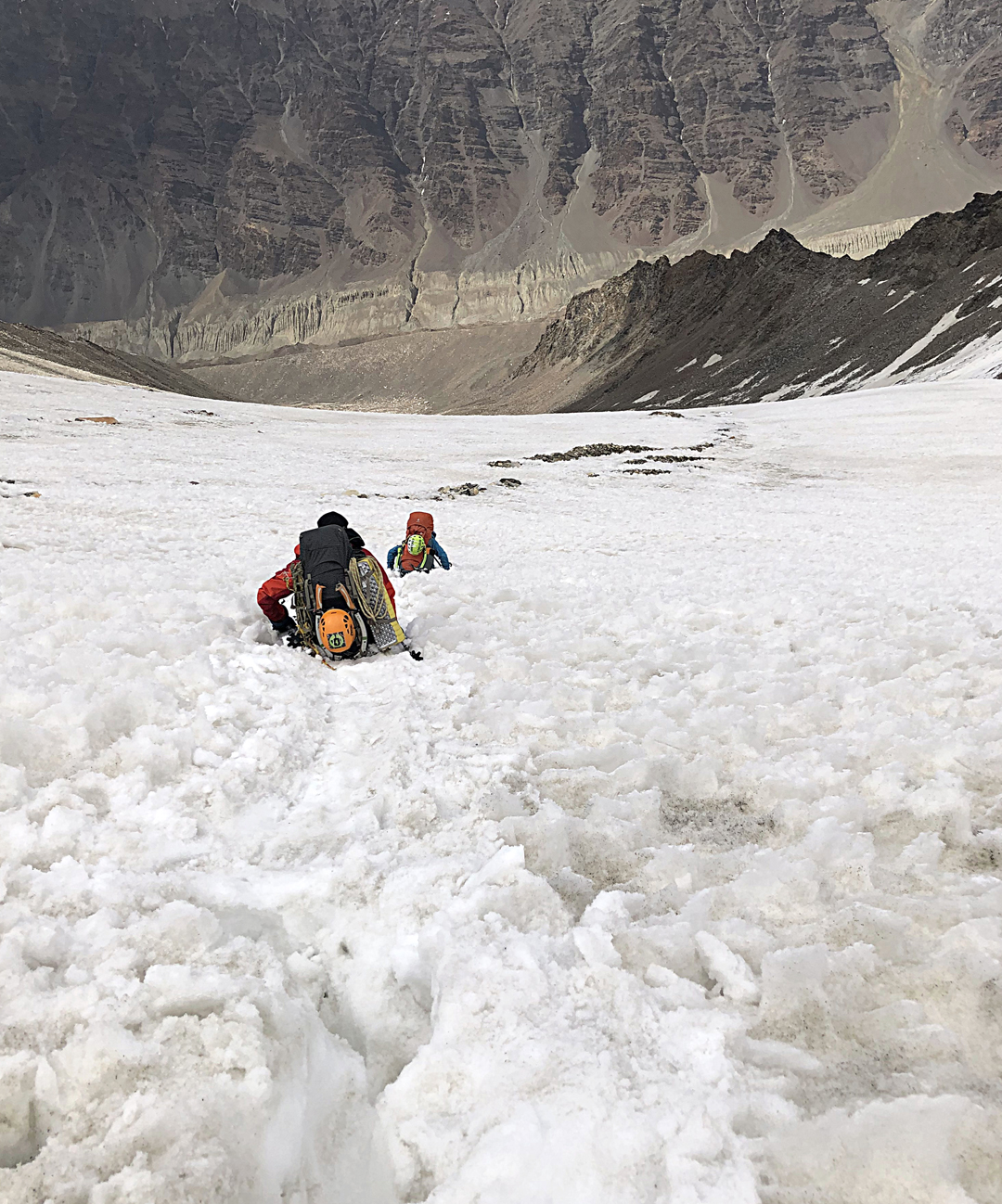 Simon Schiefer and Magdalena Ritzau descending the normal route on Bhagirathi II in heavy snow. They are below the point where the route bends northward to reach the Chaturangi Valley, seen below. 