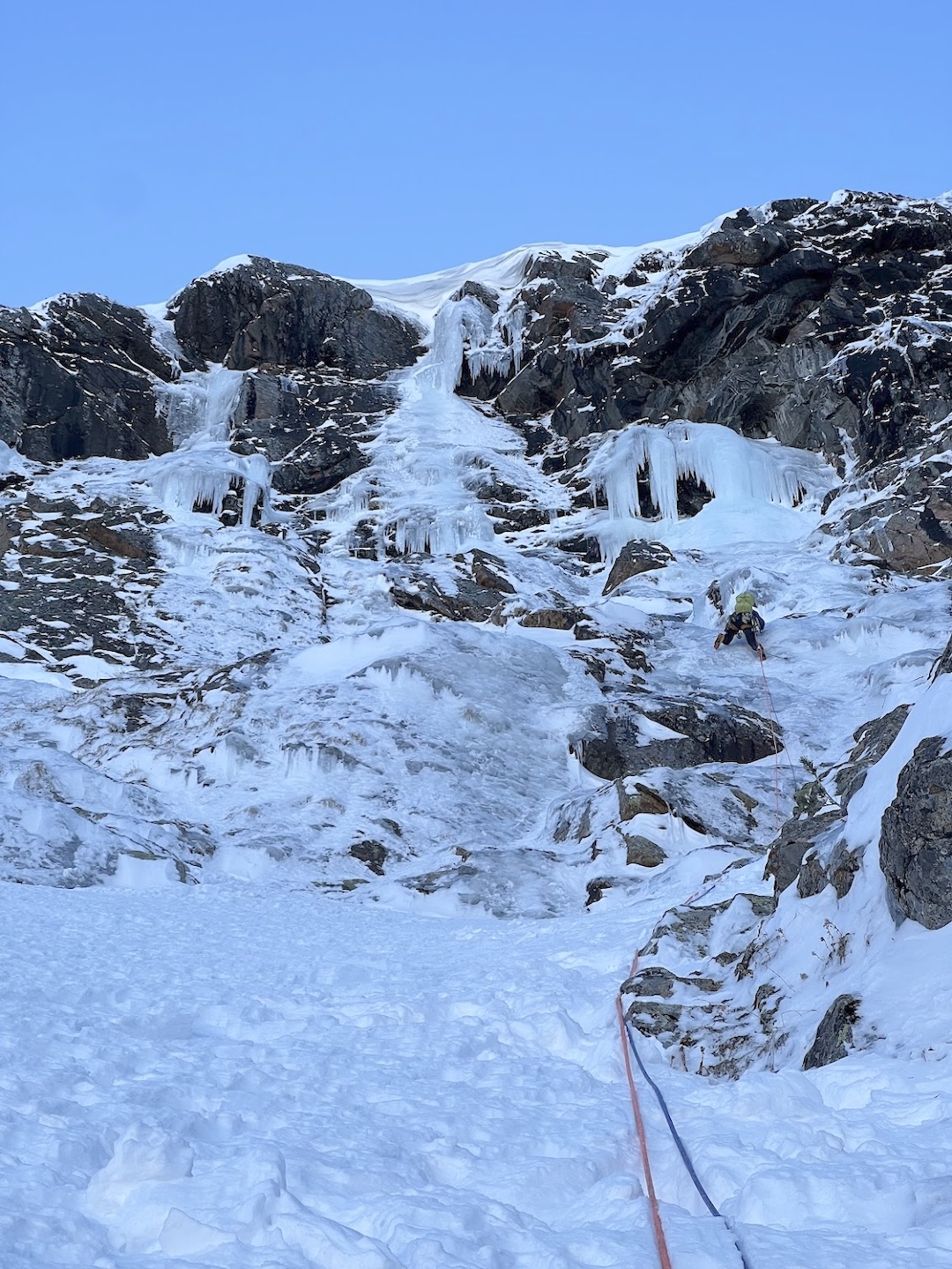 Lauren Smith simul-climbing toward the cornice high up on Lightning and Chunder on Giant’s Belly.  