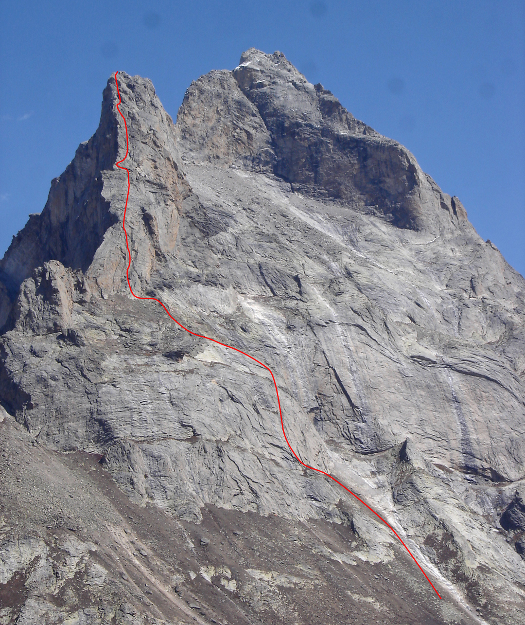Karma on the southwest face of Iris Peak (5,200m). The higher summit of Castle Peak is to the right. There are many more routes on this side of Castle Peak, some of which are marked in AAJ 2009. 