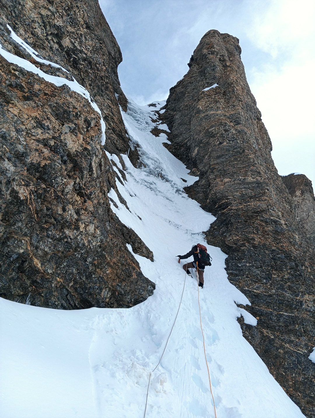 Moving up during an initial, two-man attempt to climb Monto III. The two climbed from the col between Montos III and IV, and although they got very high on the mountain—perhaps within ten vertical meters of the top—they did not reach the true summit.  