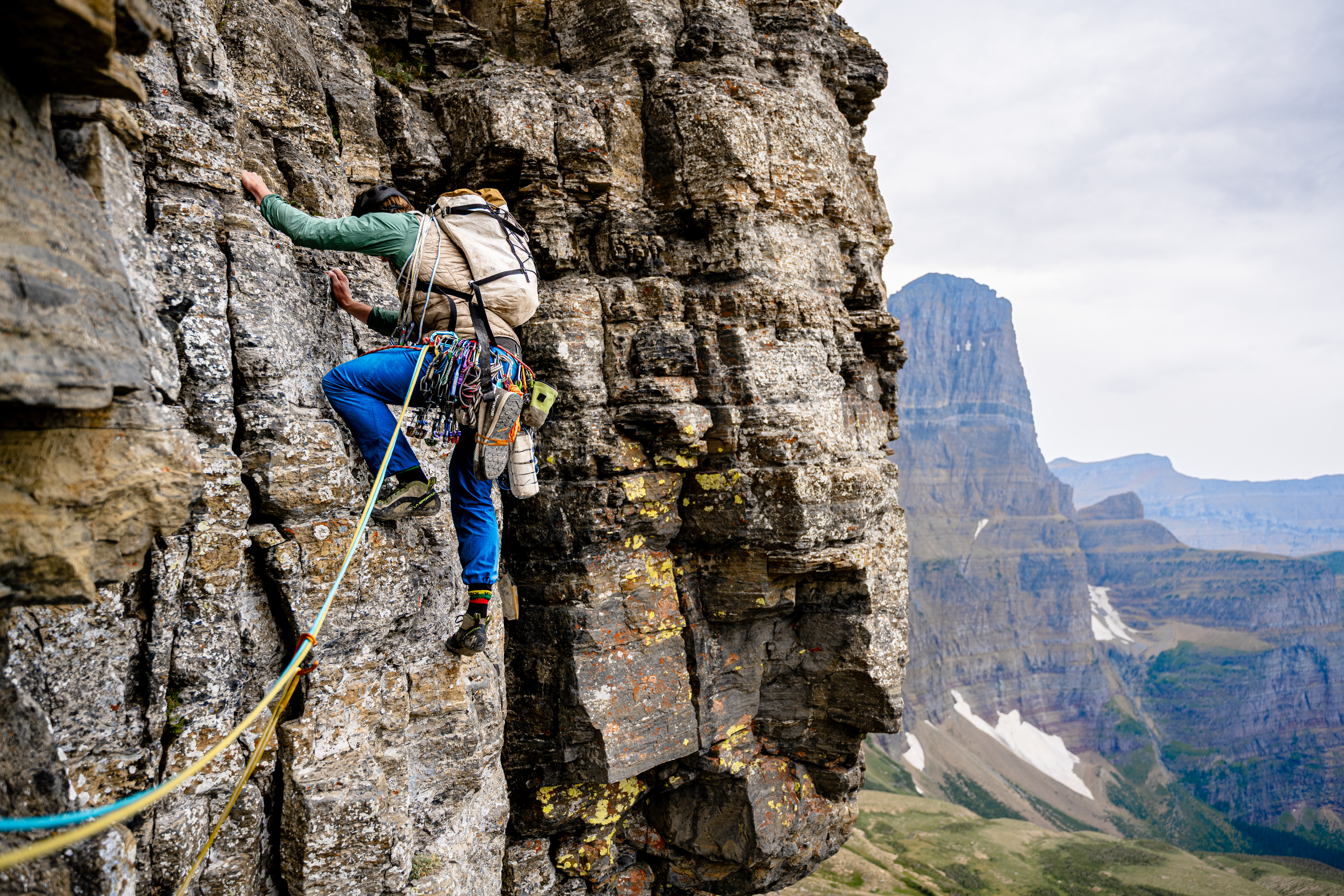 Adam Cazell starting pitch four on the north face of Cataract Mountain. Part of Mt. Gould is visible in back.