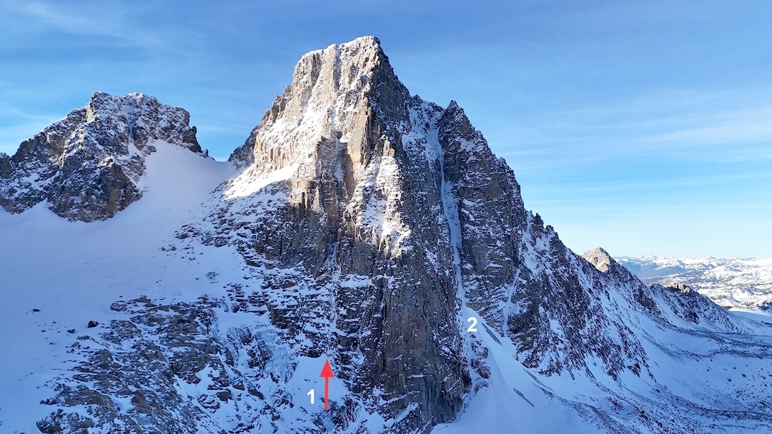 
The north side of Wolf Mountain (ca 11,820’). (1) Petrified Songs (1,700’, IV M6), linking the couloir to the upper northeast face and the summit, with a descent to Wolf Glacier on the left. (2) Northwest Couloir (Willis-Willis, 2022 to summit, with possible earlier ski descents of the couloir). 

