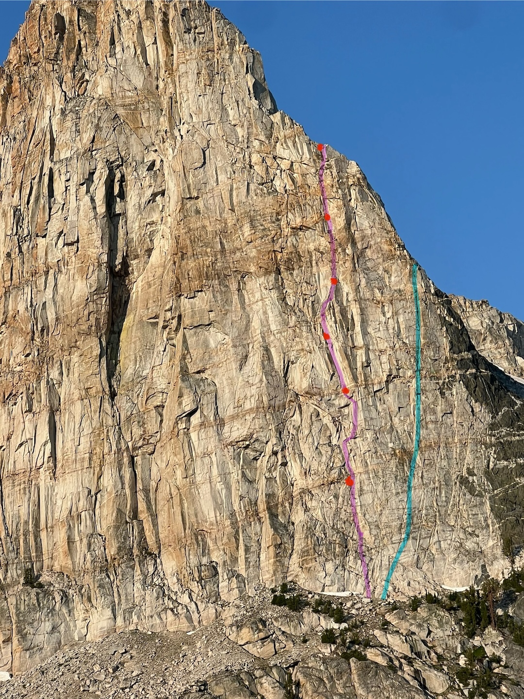 Pink line: Phase Change (1,200’, 7 pitches, 5.11, 2024) on Flatiron Butte. Blue line: Parasitic Nematode (IV 5.10+, 2014). 