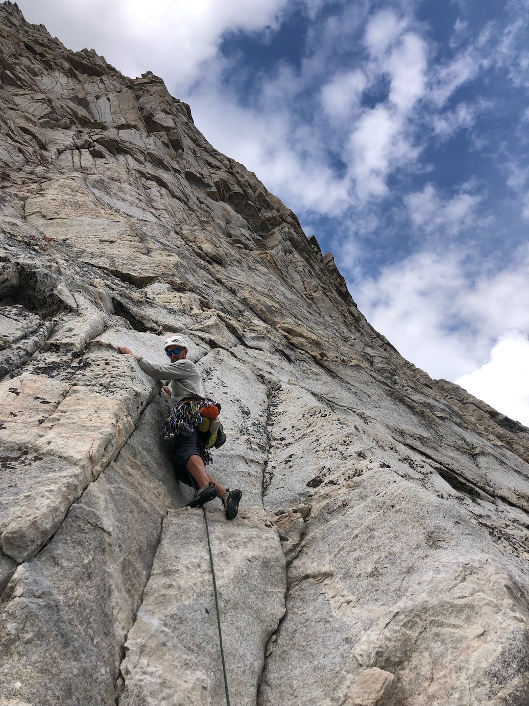 Henry Feder on the first pitch of Phase Change (1,200’, 5.11) on Flatiron Butte, Sierra Nevada, California.  

