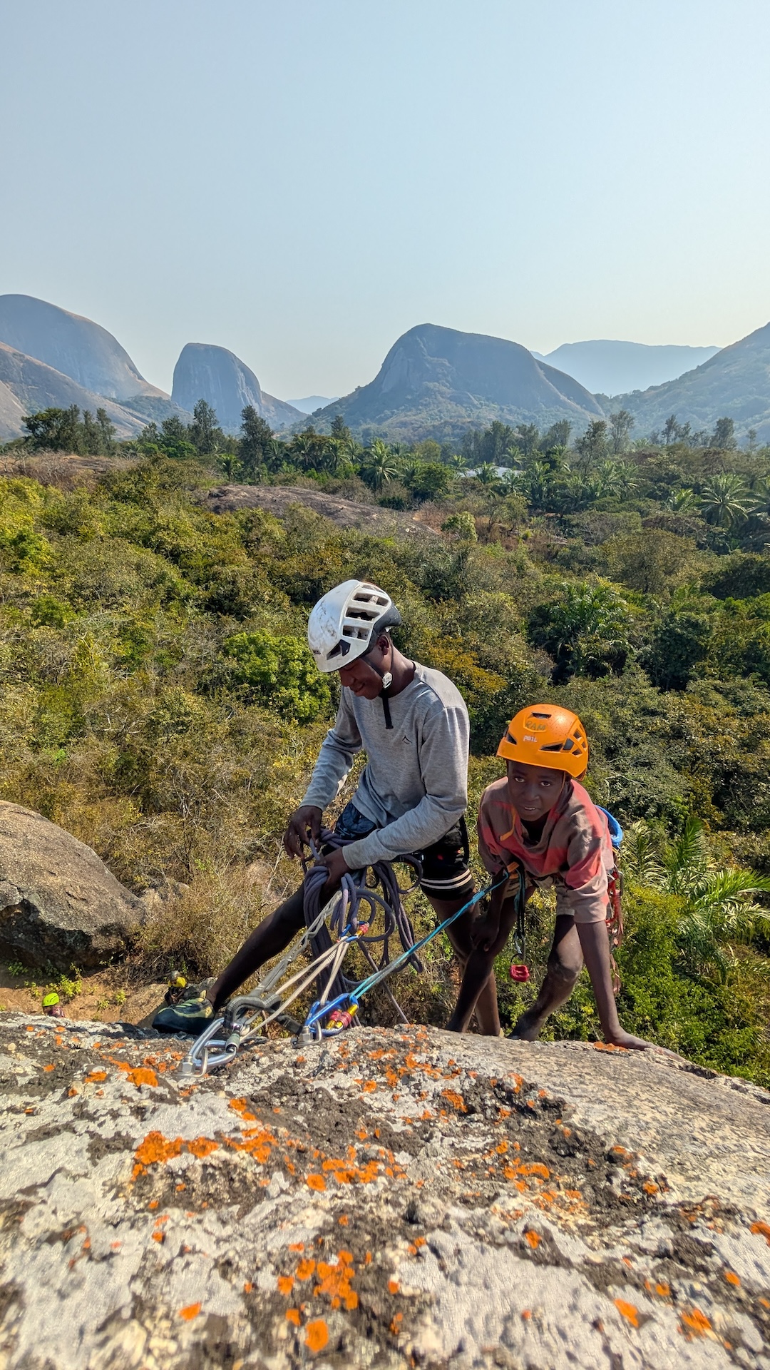 Two young local climbers, Meneses and Ramiro, learning rope skills.