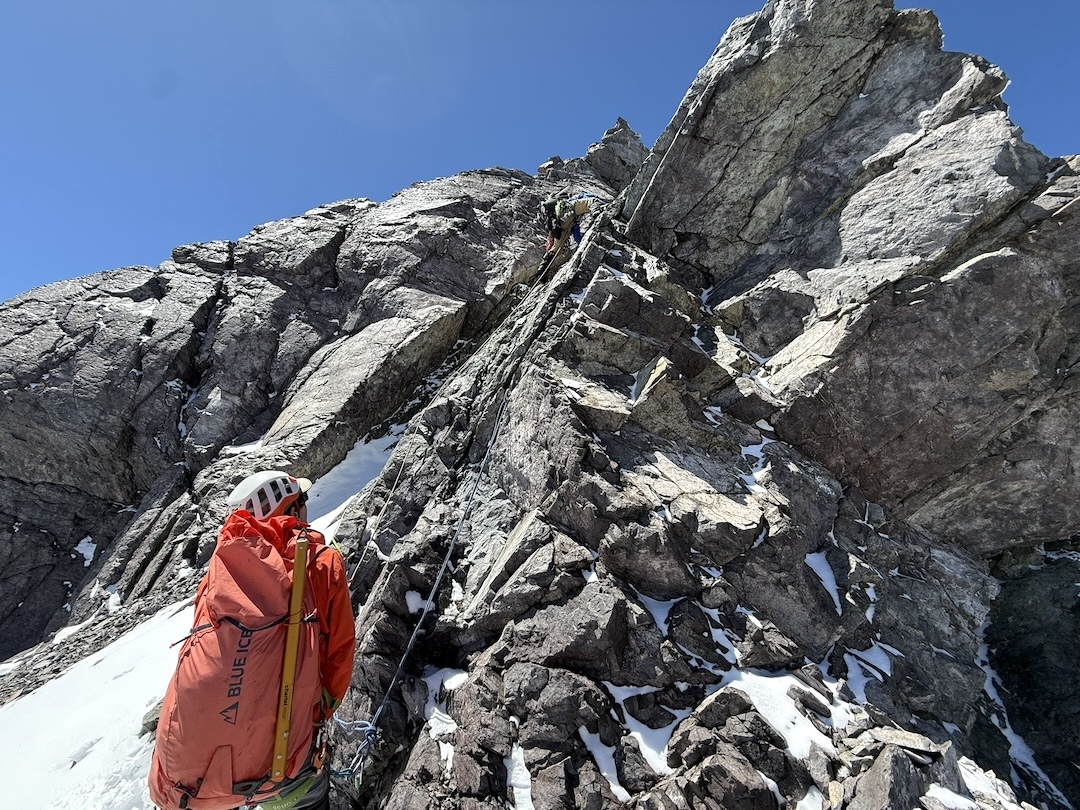José Vial leading the first pitch of rock climbing on Cerro Socavones, belayed by Agustín Ferrer.