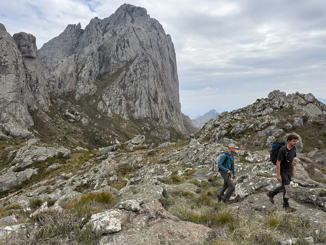Spencer Gray and Thibau Grandjean at a small col beneath Pic Dondy’s south aspect. Regicide follows a line on the east face just inside of the prominent pillar in profile on the right. 