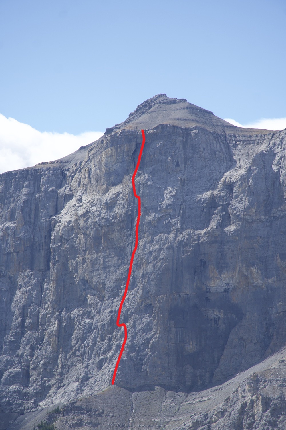 The approximate line of On the Wings of Maybe (10 pitches, 5.12+/5.13-) on the Rimwall. 