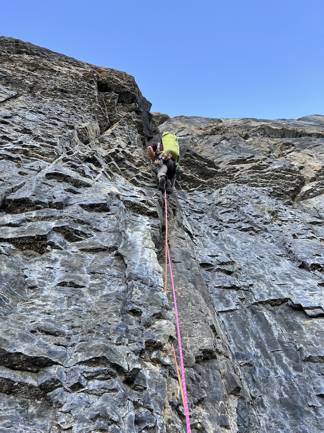 Greg Barrett climbing a couple pitches above the bivy on Snafflehound Spine, Mt. Chephren.  