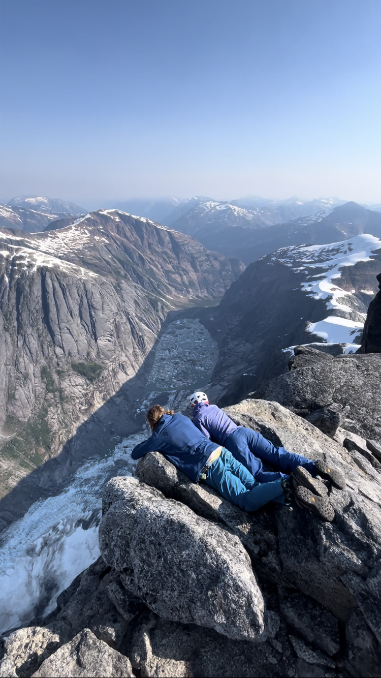Anna Feldman and Wiley Holbrooke look down into Pangea Valley from the summit of Gilt Peak. 