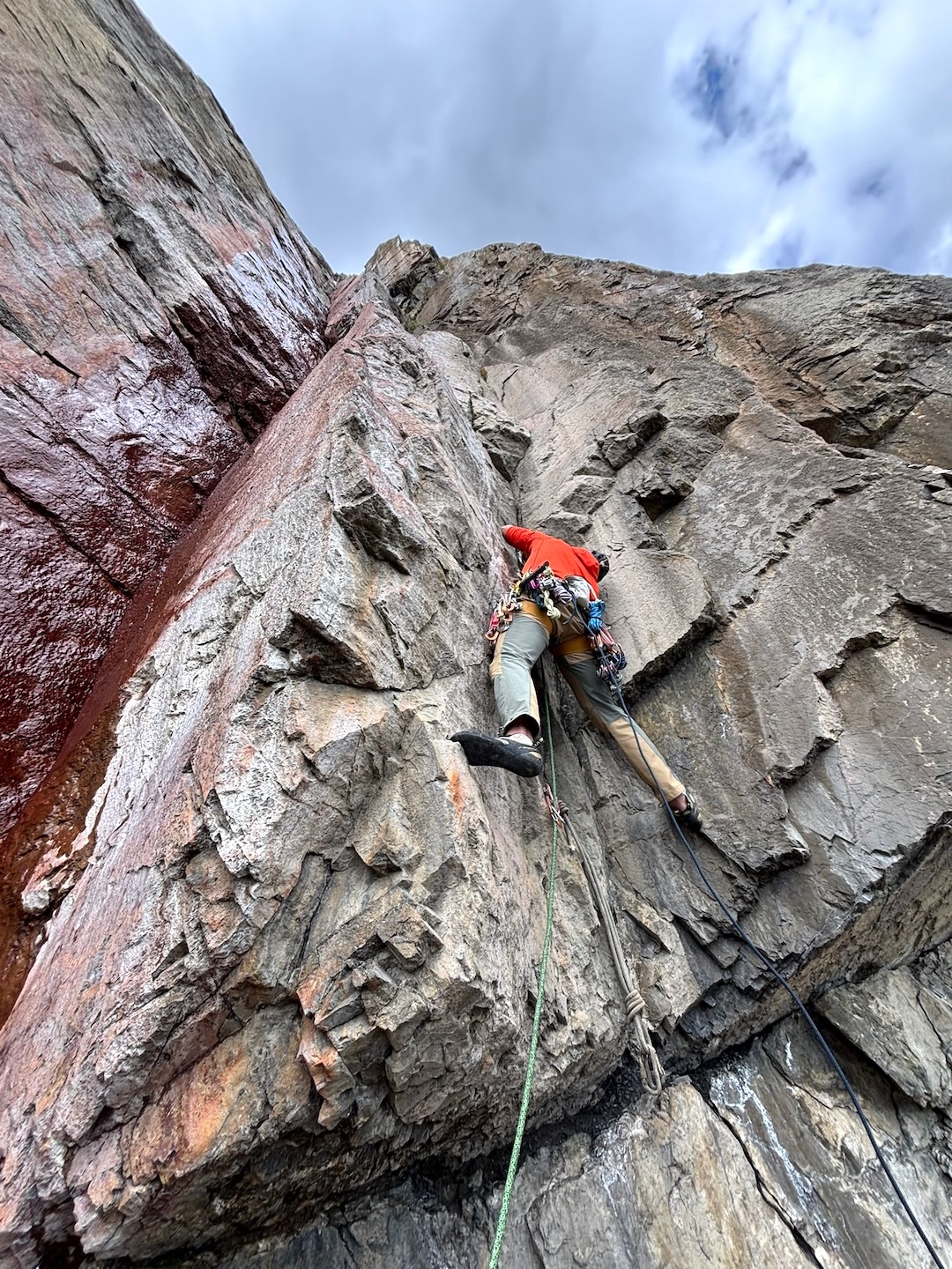 The intimidating pitch five crux of Iron Tears (465m, TD- 5.11-), above an old fixed anchor from a winter attempt on the line. 