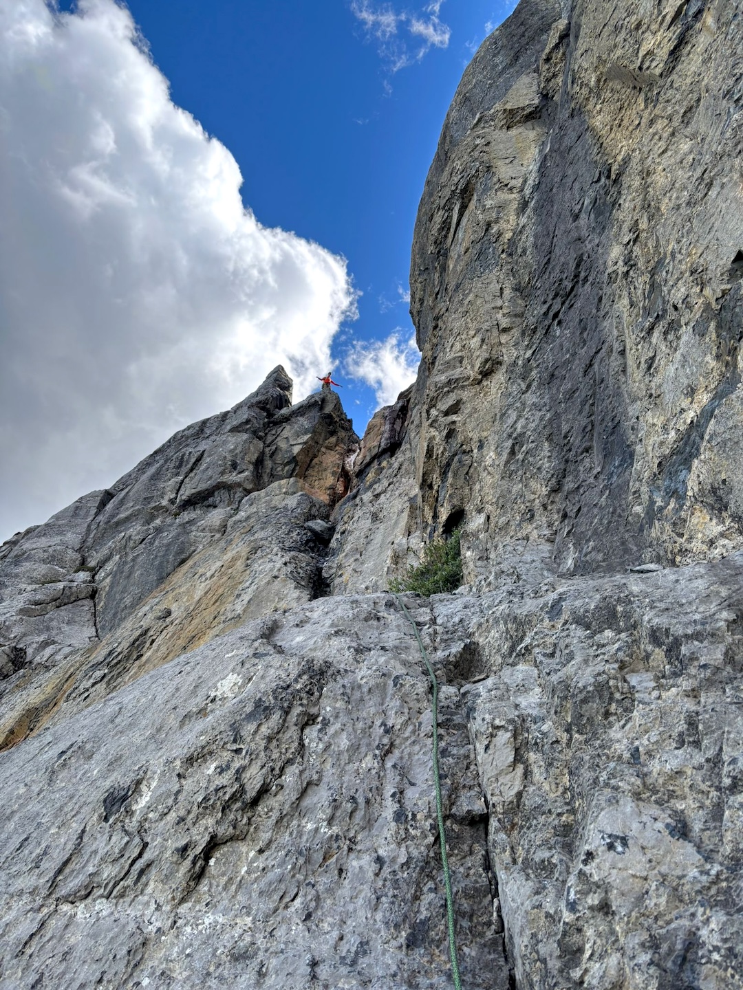 The final pitch of Iron Tears (465m, TD- 5.11-), exiting at the source of the red flow. 