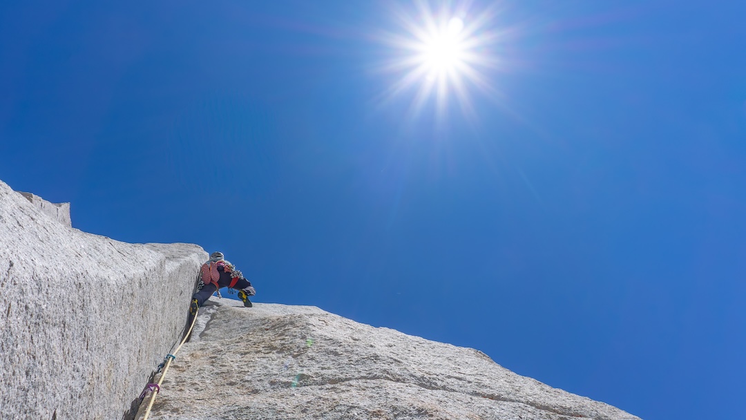 Zach Lovell leading one of the excellent 5.11 pitches high on Dr. Bear Love Free (800’, 4 pitches, 5.13a), on the north buttress of Merriam Peak, Granite Park area, Sierra Nevada, California. 