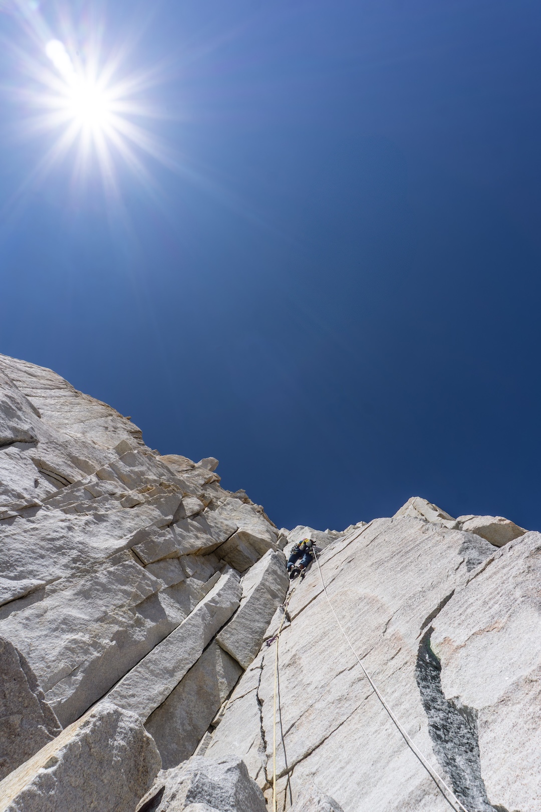 Japhy Dhungana leading the first pitch of Careful What you Fish For (600’, 5.11a), on Fish Tail Spire in the Granite Park area. 

