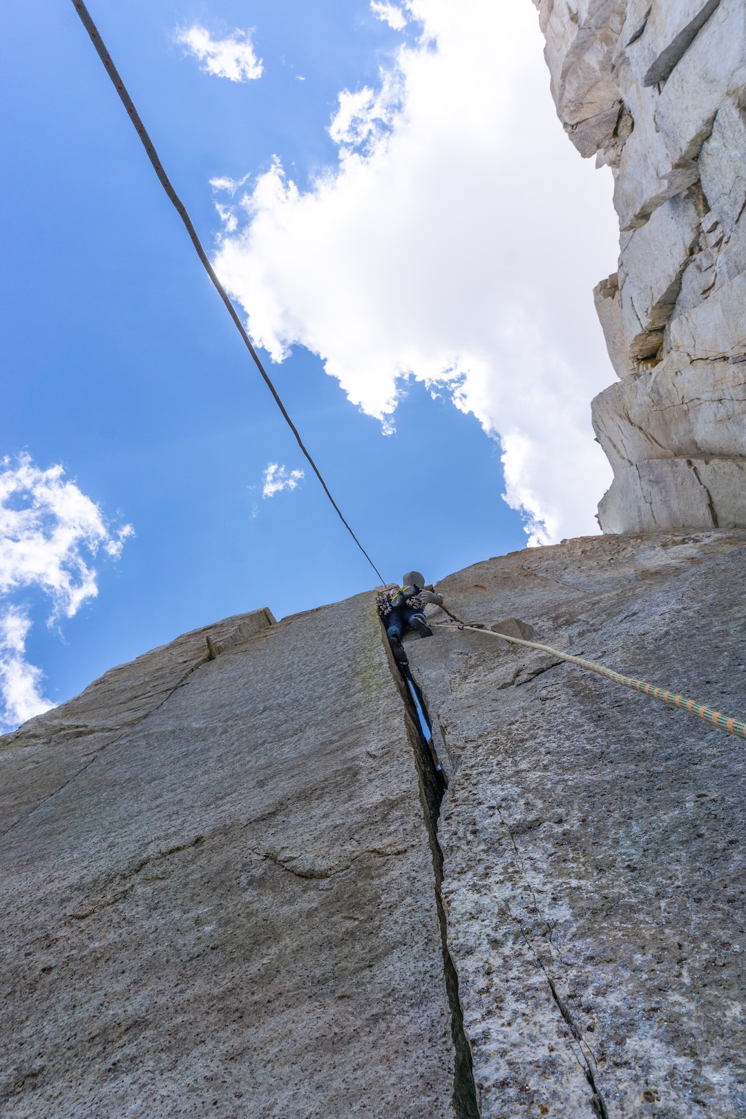 Japhy Dhungana leading one of the upper pitches on Fish You Were Here (600’, 5.12a), Fish Tail Spire. 