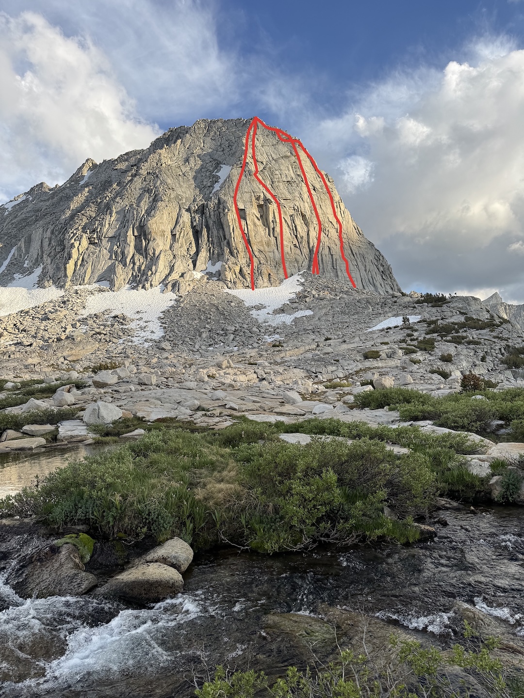 
The northeast-facing wall of Hershey’s Kiss with the lines (left to right) of Wonka’s Way (7 pitches, 5.11c), established by Leo Franch and Jake Whisenant in 2025; Sugaree (1,200’, IV 5.11c), established by Chaz Langlier, Vitaliy Musiyenko, and Brian Prince in 2019; and Tin Fish (1,000’, 6 pitches, IV 5.10c) and Vibe Vendetta (1,100’, 7 pitches, IV 5.11-), both established by Matt Allen and Thomas Sicilian in 2025. 

