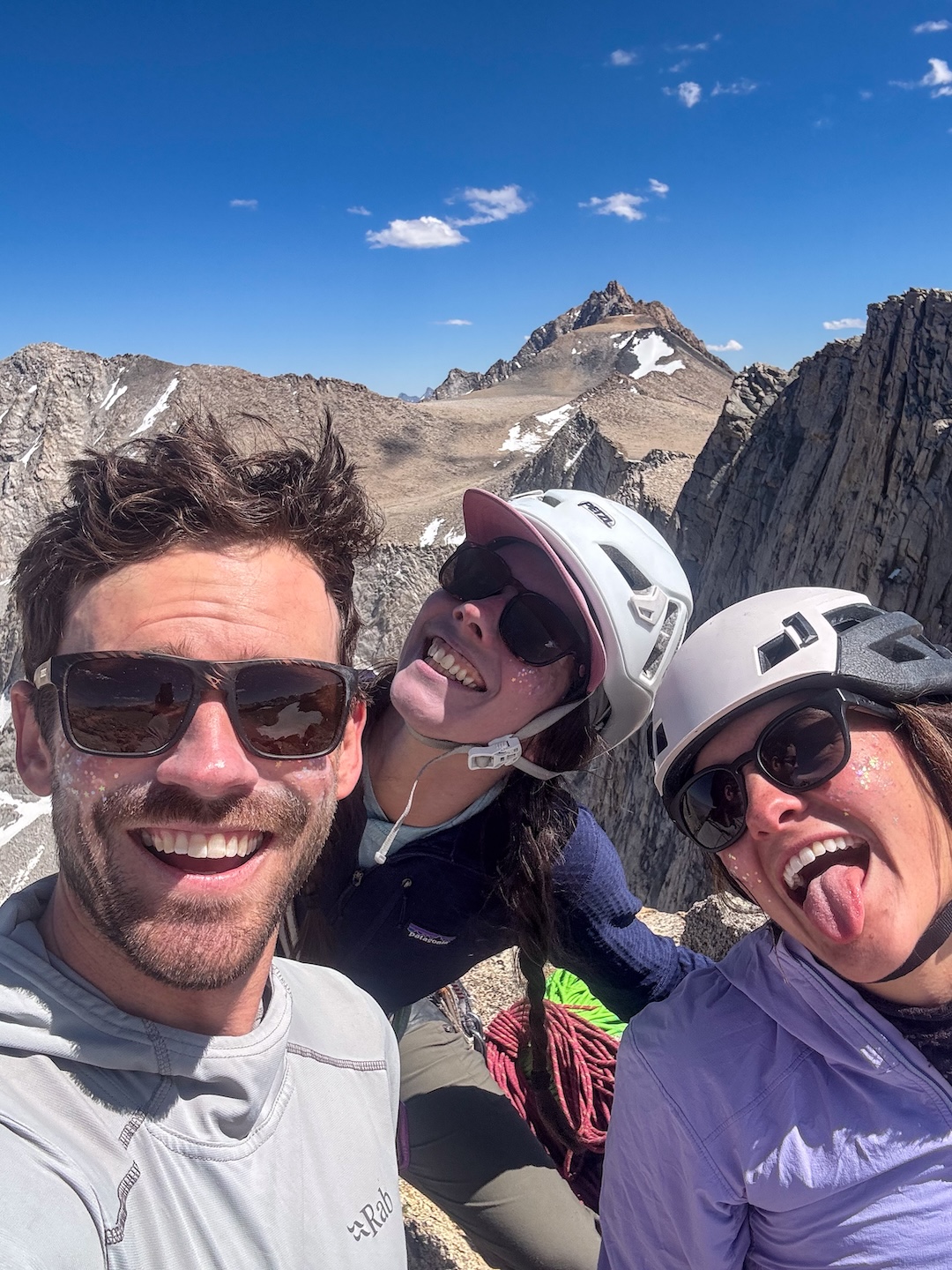 (Left to right) Zach Lovell, Sara Green, and Syd Knadler on the summit of Four Gables, sporting their glitter face paint. 
