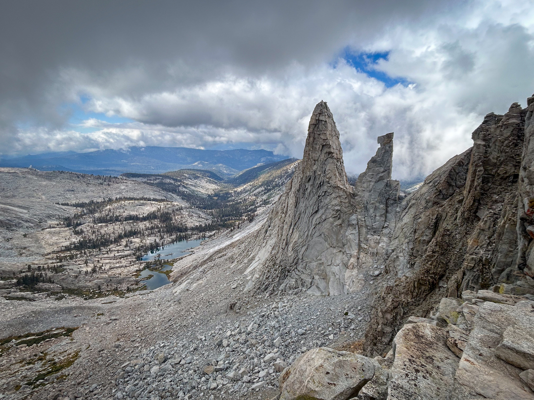 The west face of the Candlestick, seen from the south. The first ascent route was near the left skyline. The smaller tower, nicknamed the Box Cutter, remains unclimbed. 